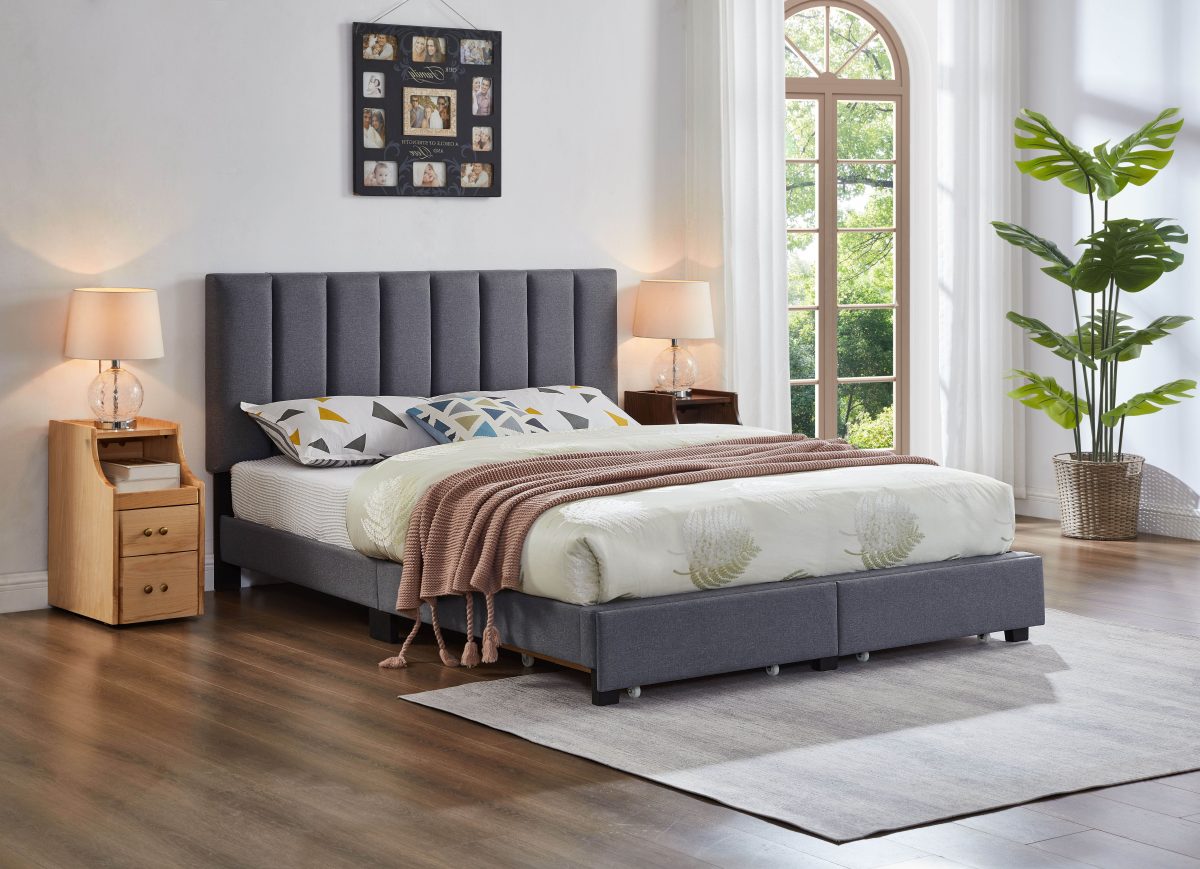 grey channel tufted bed in room with white wallpaper